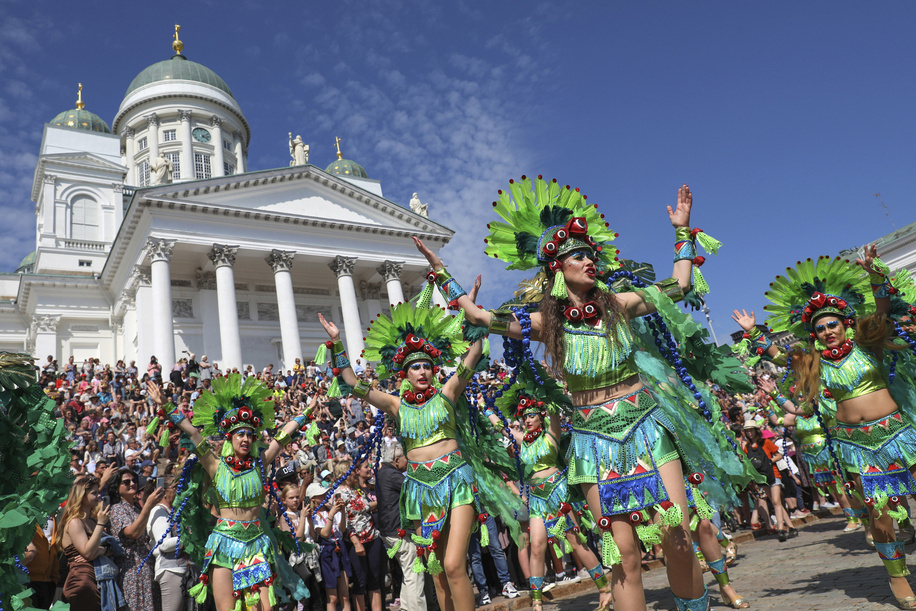 Samba performers dressed in colorful costumes dance at the Senate Square during the Helsinki Day celebrations On June 11, 2022, in a capital of Finland, a Samba Carnival was held as part of the Helsinki Day celebration.