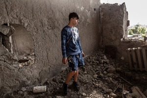 Arseniy, a college student poses in what was left from his bedroom in an apartment of a residential building destroyed by bombardment. Four months after Russia launched its invasion of Ukraine, fighting has moved from areas around the capital Kyiv to eastern regions. Just 25 kilometers from Kyiv, however, the town of Irpin still bears the scars of heavy fighting and shelling, which reduced many buildings to ruins.