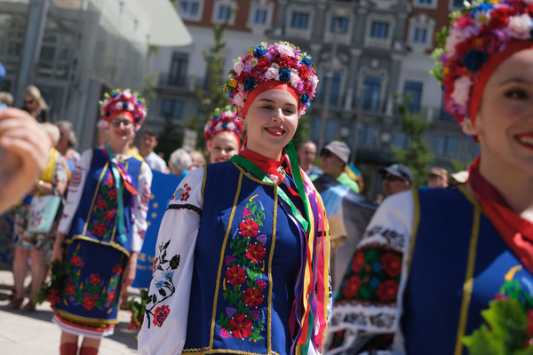 A demonstrator is seen dressed in the traditional Ukrainian costume during a rally in solidarity with Ukraine and against the Russia- Ukraine war at the Plaza de Espana in Madrid.