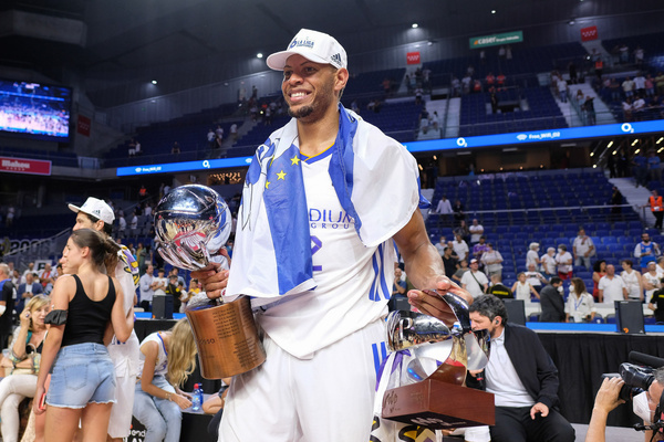 Walter Tavares of Real Madrid poses with a trophy as he celebrates victory after the Liga Endesa 2021/2022 at Wizink Center.
