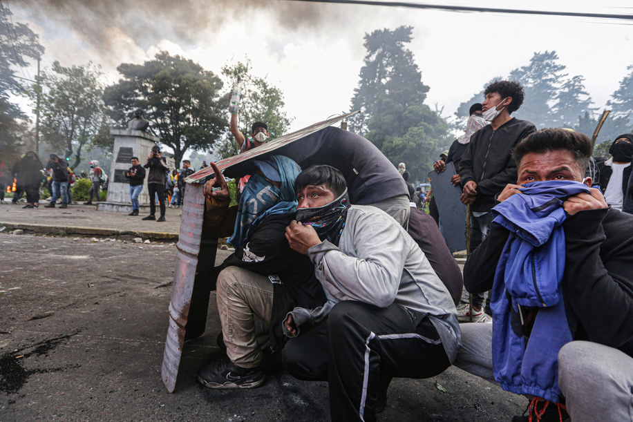 Young protesters take cover behind their handmade shields during the demonstration. Ninth day of protests in Ecuador against the government of President Guillermo Lasso, from the front line of the indigenous movement people clashed with the police officers.