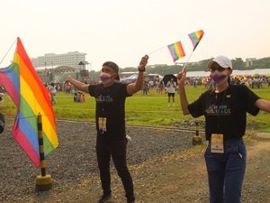 Volunteer staff of the festival welcoming the LGBTQ participants with a dance while holding rainbow flags during the Metro Manila Pride March. LGBTQ (Lesbian, Gay, Bisexual, Transgender and Queer) activists staged the annual Pride March and Festival at CCP Open Grounds in Pasay City.