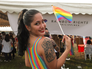 A participant holds a rainbow flag during the Metro Manila Pride March. LGBTQ (Lesbian, Gay, Bisexual, Transgender and Queer) activists staged the annual Pride March and Festival at CCP Open Grounds in Pasay City.