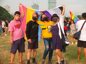 Participants pose with a flag during the Metro Manila Pride March. LGBTQ (Lesbian, Gay, Bisexual, Transgender and Queer) activists staged the annual Pride March and Festival at CCP Open Grounds in Pasay City.