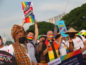 LGBTQ participants make Korean heart sign during the Metro Manila Pride March. LGBTQ (Lesbian, Gay, Bisexual, Transgender and Queer) activists staged the annual Pride March and Festival at CCP Open Grounds in Pasay City.