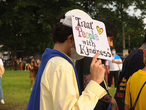 A participant holds a placard saying "Treat People with Kindness" during the Metro Manila Pride March. LGBTQ (Lesbian, Gay, Bisexual, Transgender and Queer) activists staged the annual Pride March and Festival at CCP Open Grounds in Pasay City.