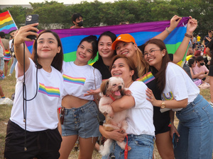 Participants seen taking selfies with the LGBT flag in the background during the Metro Manila Pride March. LGBTQ (Lesbian, Gay, Bisexual, Transgender and Queer) activists staged the annual Pride March and Festival at CCP Open Grounds in Pasay City.