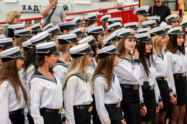Female cadets graduates dressed in uniforms are seen during the ceremony at the Odessa Maritime Academy.