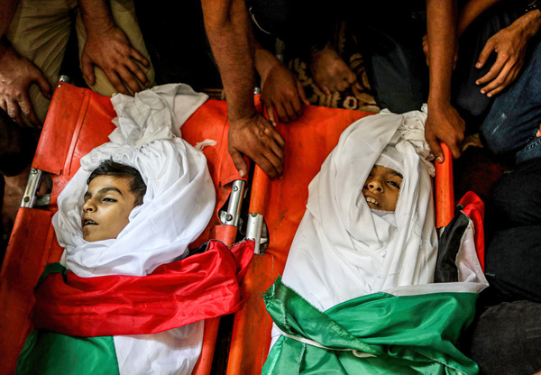 (EDITORS NOTE: Image depicts death)
Relatives of Yasser Al Nabahin and his three children sit next to their corpses during the funeral, killed in an Israeli air strike on the Bureij refugee camp in the central Gaza Strip. The ceasefire ended 3 days of violence between Islamic Jihad and Israel that began on Friday when Israel killed the leaders of its military wing For Islamic Jihad, Tayseer Al-Jabari, and Khaled Mansour in the Gaza Strip.