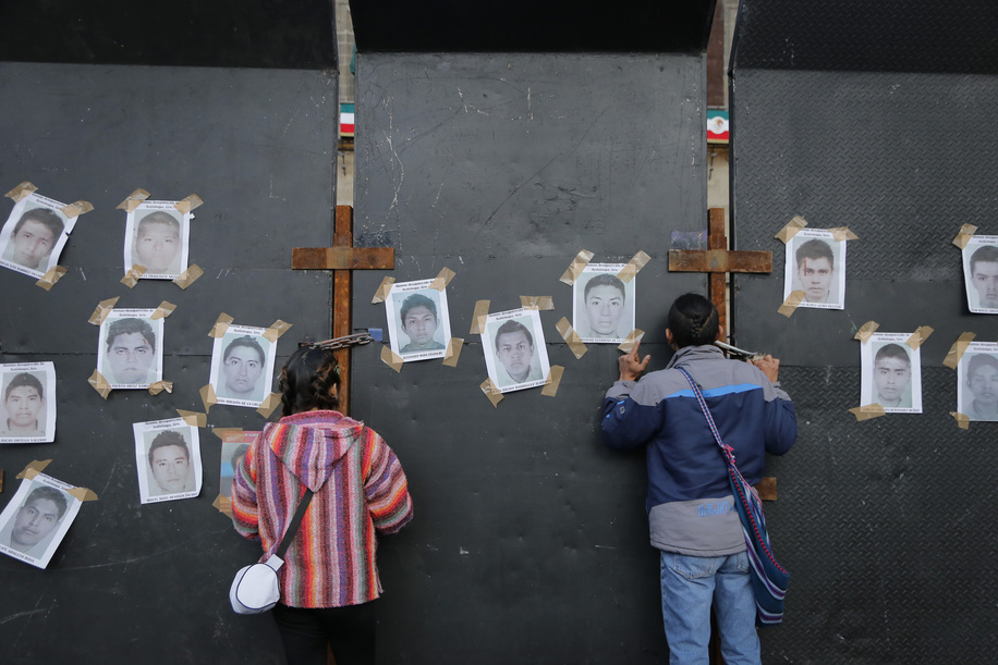 Protesters look through the fence with pictures of the 43 missing students during a demonstration to commemorate the 8th anniversary of the disappearance of the 43 Ayotzinapa students. On the night of September 26, 2014, 43 students from the Raœl Isidro Burgos Rural Normal School located in Iguala, Guerrero, were victims of forced disappearance by members of public security from the state of Guerrero and federal military security.
The students had allegedly tried to hijack trucks to use for their protests.