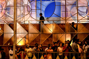 People take photos in front of the entrance of different Pandals (Temporary places for Worship). The city of Kolkata celebrates the largest festival of Bengali, Durga puja. Durga is a description of the power of the goddess in Hindu Mythology. UNESCO (The United Nations Educational, Scientific and Cultural Organization) in 2021 included Durga puja in the Representative list of the intangible cultural heritage of Humanity.