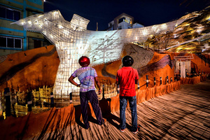 Visitors are seen in front of an installation of a Pandal (Temporary place for Worship) decorated with creative concepts during the Durga puja festival. The city of Kolkata celebrates the largest festival of Bengali, Durga puja. Durga is a description of the power of the goddess in Hindu Mythology. UNESCO (The United Nations Educational, Scientific and Cultural Organization) in 2021 included Durga puja in the Representative list of the intangible cultural heritage of Humanity.