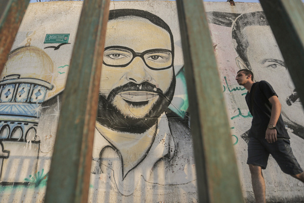 A mural of Fathi Shikaki, founder of the Islamic Jihad Movement in Palestine, is seen on the 35th anniversary of the movement's founding in Gaza City.