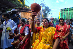 Women dressed in traditional Bengali dresses during the immersion procession at Bagbazar. Durga Puja, an annual festival that marks victory of good over evil is celebrated by Hindus all over India & abroad. It is an occasion of great enthusiasm and festivity for the Hindus. On the last day, the day of Bhashan or Vijoya Dashami images and idols are immersed in water.