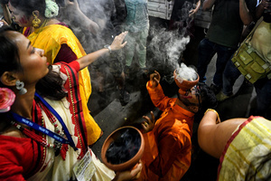 Hindu devotees perform dhunuchi dance on the occasion of Durga Puja immersion at Kolkata. Durga Puja, an annual festival that marks victory of good over evil is celebrated by Hindus all over India & abroad. It is an occasion of great enthusiasm and festivity for the Hindus. On the last day, the day of Bhashan or Vijoya Dashami images and idols are immersed in water.