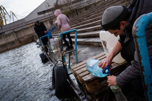 Residents of Kherson are collecting water at the pier in the Dnipro River. Kherson, the southern regional capital, still lacks basic water and electricity supply due to the Russian occupation in the area.