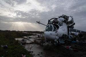 A damaged combat helicopter Mil Mi-24 is seen at the Kherson airport. Kherson airport was left with wreckage after Ukrainian troops attacked the base of the Russian forces during their occupation of the area. The Russian troops have fled and abandoned this strategic location.