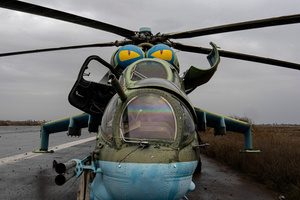 A damaged combat helicopter Mil Mi-24 is seen at the Kherson airport. Kherson airport was left with wreckage after Ukrainian troops attacked the base of the Russian forces during their occupation of the area. The Russian troops have fled and abandoned this strategic location.