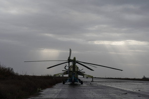 A combat helicopter Mil Mi-24 with the letter 'Z' written on the wings, was damaged in the Kherson airport. Kherson airport was left with wreckage after Ukrainian troops attacked the base of the Russian forces during their occupation of the area. The Russian troops have fled and abandoned this strategic location.