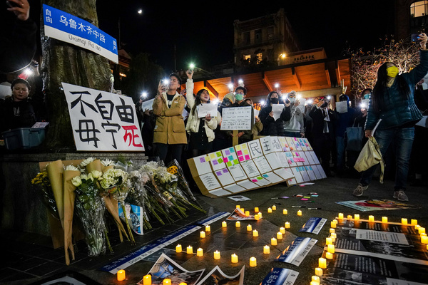 Candles are lit next to flowers and placards during a demonstration. People in China have protested against anti-virus restrictions since November 2022. Plenty of people in China marched on the streets with blank papers to require ease in the covid rules and called for that country's leader to step down. The protest was called the "A4 revolution". Hundreds of people took part in a demonstration to support the protesters in China at Portsmouth Square in San Francisco.