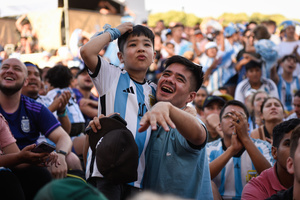 Argentina soccer fans celebrate as they watch FIFA World Cup round of 16 match against Australia at the World Cup, hosted by Qatar, in Buenos Aires. (Final scores; Argentina 2-1 Australia).