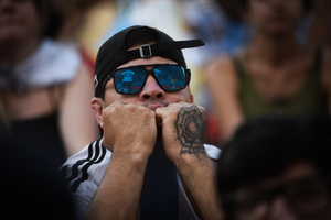 Argentina soccer fan reacts as he watches FIFA World Cup round of 16 match against Australia at the World Cup, hosted by Qatar, in Buenos Aires. (Final scores; Argentina 2-1 Australia).
