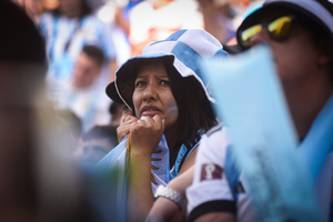Argentina soccer fan reacts as she watches FIFA World Cup round of 16 match against Australia at the World Cup, hosted by Qatar, in Buenos Aires. (Final scores; Argentina 2-1 Australia).