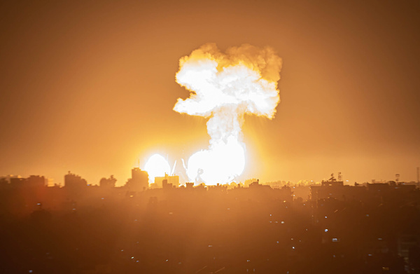 Smoke and flames rise during an Israeli air strike on Khan Yunis in the southern Gaza Strip, in response to a missile that was fired from Gaza towards Israel.