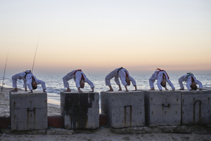 Palestinian youths show their skills and practice taekwondo on the Mediterranean beach during sunset in Khan Yunis, southern Gaza Strip. The "Funoon" taekwondo team trains taekwondo at the Mediterranean beach at sunset, as part of a training program organized by the trainers in the team, as they allocate a day of training on the seashore of Khan Yunis, southern Gaza Strip.