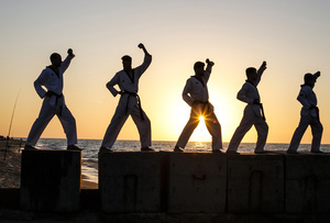 Palestinian youths show their skills and practice taekwondo on the Mediterranean beach during sunset in Khan Yunis, southern Gaza Strip. The "Funoon" taekwondo team trains taekwondo at the Mediterranean beach at sunset, as part of a training program organized by the trainers in the team, as they allocate a day of training on the seashore of Khan Yunis, southern Gaza Strip.