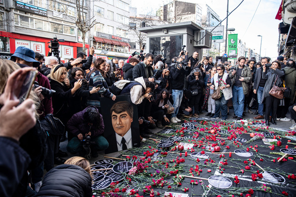 Citizens lay carnations at the place where Hrant Dink was killed. People gather for a commemoration ceremony within the 16th death anniversary of Hrant Dink, former editor-in-chief of the bilingual Turkish-Armenian newspaper Agos, in front of the Agos newspaper building in Istanbul. He was assassinated in front of the Agos newspaper building in Istanbul in 2007.