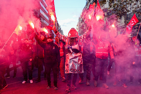 Demonstrators from the FO (Force Ouvrière) union hold smoke bombs during the rally. France's trade unions have called for protests against the new pension reform which is to be presented next month by French Prime Minister Elisabeth Borne. The Police estimated 26,000 protesters and the unions estimated 145,000 marched through the streets of Marseille. The Interior ministry reported more than a million on the streets throughout France, while the unions claimed more than 2 million.