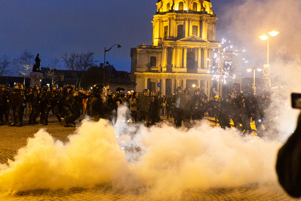 Police squad is seen near a cloud of tear gas during the clashes between demonstrators and the police in Paris. French pension reform strikes take place for the second time this month where hundreds of thousands took the streets in Paris to pressure President Emmanuel Macron to drop the pension reform plan.