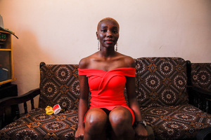 A 23-Year-Old model Risper Atieno poses in her room in the Kibera Slum. The young Kenyan youths are driven into a competency of having their own homes away from their parents where they, most importantly, learn to tackle life through different challenges. The competition to have the best-decorated rooms filled with different designer outfits is one way of avoiding daily difficulties such as drug abuse, teenage pregnancies, early marriages, and negative judgments from locals. To most young youths having a home is the start of a new life, and it comes with many responsibilities. Unauthorized housing is the most lucrative investment in Kenya today. Therefore for one to have a house with landlords renting rooms to let at Ksh 1,500 ($ 12) to Ksh 5000 ($ 40) a month, that is almost too hard to pay for most youths with low-income jobs and therefore needs an extra effort to raise their sources of income.