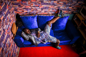 A 23-Year-Old Clinton Chogo is lying on a sofa Inside his colourfully designed house dressed in a classy outfit. The young Kenyan youths are driven into a competency of having their own homes away from their parents where they, most importantly, learn to tackle life through different challenges. The competition to have the best-decorated rooms filled with different designer outfits is one way of avoiding daily difficulties such as drug abuse, teenage pregnancies, early marriages, and negative judgments from locals. To most young youths having a home is the start of a new life, and it comes with many responsibilities. Unauthorized housing is the most lucrative investment in Kenya today. Therefore for one to have a house with landlords renting rooms to let at Ksh 1,500 ($ 12) to Ksh 5000 ($ 40) a month, that is almost too hard to pay for most youths with low-income jobs and therefore needs an extra effort to raise their sources of income.
