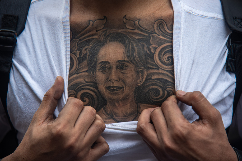 A protester reveals a tattoo of Aung San Suu Kyi on his chest during the demonstration. Burmese in Thailand gather outside the Myanmar Embassy in Bangkok to mark 2 years since the Myanmar military seized power from a democratically elected civilian government on Febuary 1, 2021.
