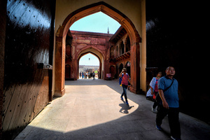 Tourists visit the Agra fort which is just beside of the Taj mahal. The Taj Mahal is a mausoleum located in the right bank of the river Yamuna - Agra, India, built by Mughal Emperor Shah Jahan in memory of his favorite wife, Mumtaz. The Taj Mahal is considered the finest example of Mughal architecture, a style that combines elements from Persian, Oman, Indian, and Islamic architectural styles. The Taj Mahal is in the list of modern Seven Wonders of the World and It has also been a protected UNESCO World Heritage Site since 1983.