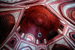 Interior view of the Prayer house inside The Taj Mahal. The Taj Mahal is a mausoleum located in the right bank of the river Yamuna - Agra, India, built by Mughal Emperor Shah Jahan in memory of his favorite wife, Mumtaz. The Taj Mahal is considered the finest example of Mughal architecture, a style that combines elements from Persian, Oman, Indian, and Islamic architectural styles. The Taj Mahal is in the list of modern Seven Wonders of the World and It has also been a protected UNESCO World Heritage Site since 1983.