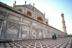 Young brothers visit the Taj Mahal in Agra. The Taj Mahal is a mausoleum located in the right bank of the river Yamuna - Agra, India, built by Mughal Emperor Shah Jahan in memory of his favorite wife, Mumtaz. The Taj Mahal is considered the finest example of Mughal architecture, a style that combines elements from Persian, Oman, Indian, and Islamic architectural styles. The Taj Mahal is in the list of modern Seven Wonders of the World and It has also been a protected UNESCO World Heritage Site since 1983.