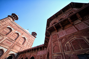 Decoration of works on the wall of Agra fort. The Taj Mahal is a mausoleum located in the right bank of the river Yamuna - Agra, India, built by Mughal Emperor Shah Jahan in memory of his favorite wife, Mumtaz. The Taj Mahal is considered the finest example of Mughal architecture, a style that combines elements from Persian, Oman, Indian, and Islamic architectural styles. The Taj Mahal is in the list of modern Seven Wonders of the World and It has also been a protected UNESCO World Heritage Site since 1983.