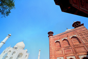 A view of The Taj Mahal. The Taj Mahal is a mausoleum located in the right bank of the river Yamuna - Agra, India, built by Mughal Emperor Shah Jahan in memory of his favorite wife, Mumtaz. The Taj Mahal is considered the finest example of Mughal architecture, a style that combines elements from Persian, Oman, Indian, and Islamic architectural styles. The Taj Mahal is in the list of modern Seven Wonders of the World and It has also been a protected UNESCO World Heritage Site since 1983.