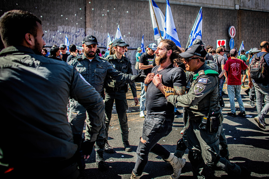 Israeli police officers arrest an anti-reform protester that blocked the Ayalon High way during the demonstration. Israeli protesters held demonstrations against the proposed judiciary overhaul plan under the government of Prime Minister Benjamin Netanyahu. Israeli fears that it would give Netanyahu control over judicial appointments.