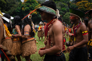 A group of indigenous people wearing ornaments seen dancing and singing during the celebrations of the Indigenous People’s Day, at the Aldeia Katurãma.