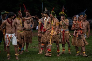 Indigenous men wearing traditional outfits and ornaments during games at the celebrations of the Indigenous People’s Day, at the Aldeia Katurãma.