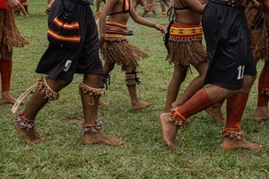 Details of legs and feet of a group of indigenous people wearing ornaments during the celebrations of the Indigenous People’s Day, at the Aldeia Katurãma.