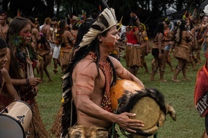 Hayó Pataxo, an indigenous community leader, plays a drum and sings during the celebrations of the Indigenous Peoples Day, at the Aldeia Katurãma.