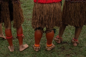 Details of the legs and feet of indigenous women wearing traditional outfits and ornaments during the celebrations of the Indigenous Peoples Day, at the Aldeia Katurãma.