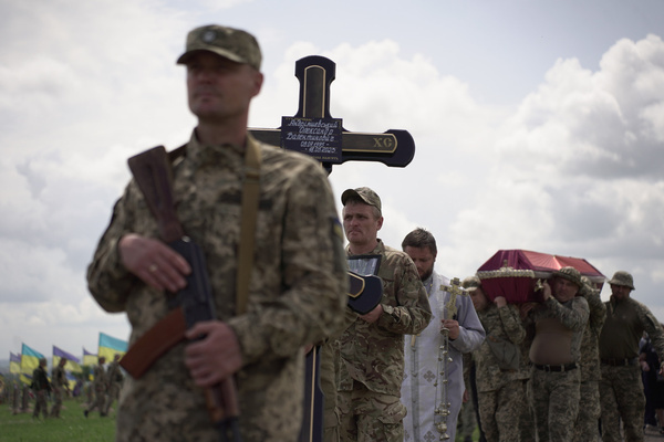 Soldiers of Ukraine's 92nd brigade walk in a funeral procession as they lead the 47-year-old Ukrainian serviceman Oleksandr's coffin to his tomb. An Orthodox military funeral was held in a Dnipro cemetery for 47-year-old Ukrainian serviceman, Oleksandr Andryashevsky. The 92nd Brigade soldier was killed by a Russian sniper on the 21st of May in Novoselivka, Kharkiv oblast.
