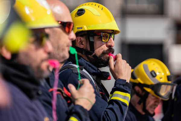Protesters blow whistles during the demonstration. Forest Firefighters of the Public Service of Madrid Community protest in Puerta del Sol Madrid, in front of the Regional Headquarters Government building demanding decent working conditions and for the defense of their rights and compliance with labor legislation.