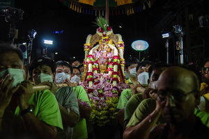 Hindu devotees carry a statue of Hindu god Lord Ganesha for worship during a ceremony to mark the Ganesh Chaturthi festival at Wat Khaek in Bangkok. The Ganesh Chaturthi is a Hindu festival to commemorate the birth of the Hindu god Lord Ganesha.